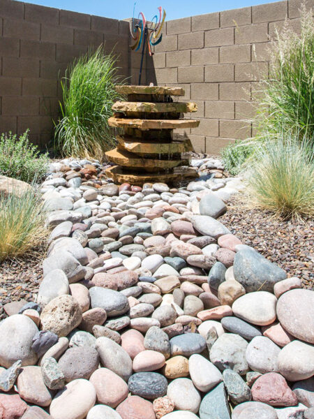 Create a rock river to your gorgeous fountain.
